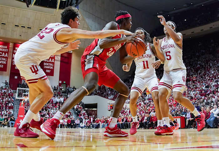 Indiana Hoosiers guard Trey Galloway (32) knocks the ball away from Ohio State Buckeyes center Felix Okpara (34) during the second half at Simon Skjodt Assembly Hall.